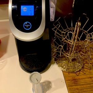 Keurig machine with extra filter and K-Cup holder.